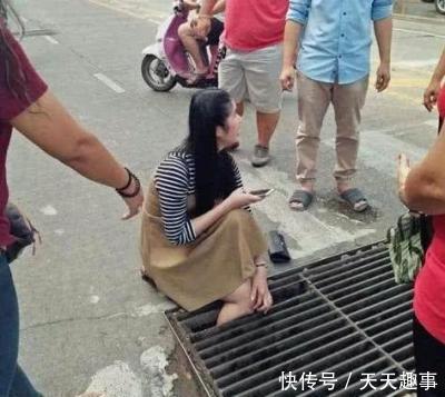 手机走路玩美女美女卡入下水道,路人来搭救,美不慎古筝李凡图片